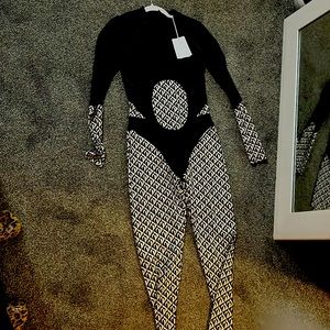 Blk and cream stylish jump suit brand new .